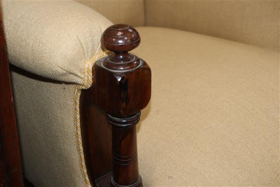 A Victorian rosewood upholstered wing armchair